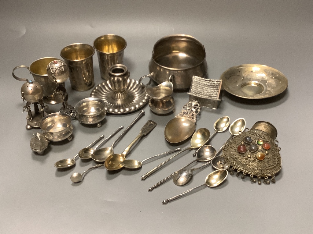 A late 19th century Russian gilt 84 zolotnik tea cup and saucer, dated 1883, a pair of similar salts and a group of other items.